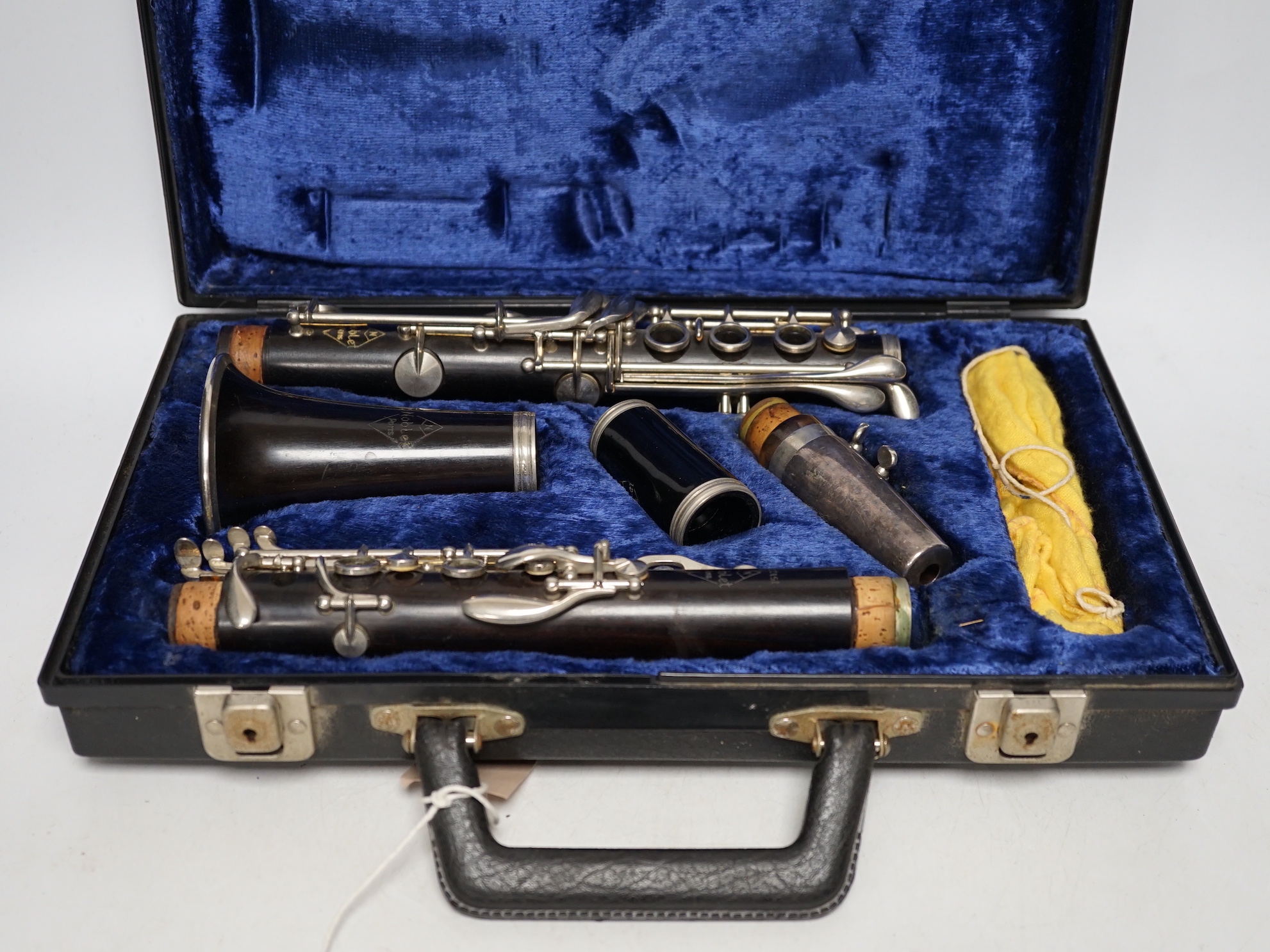 A cased French clarinet by Noblet, Paris